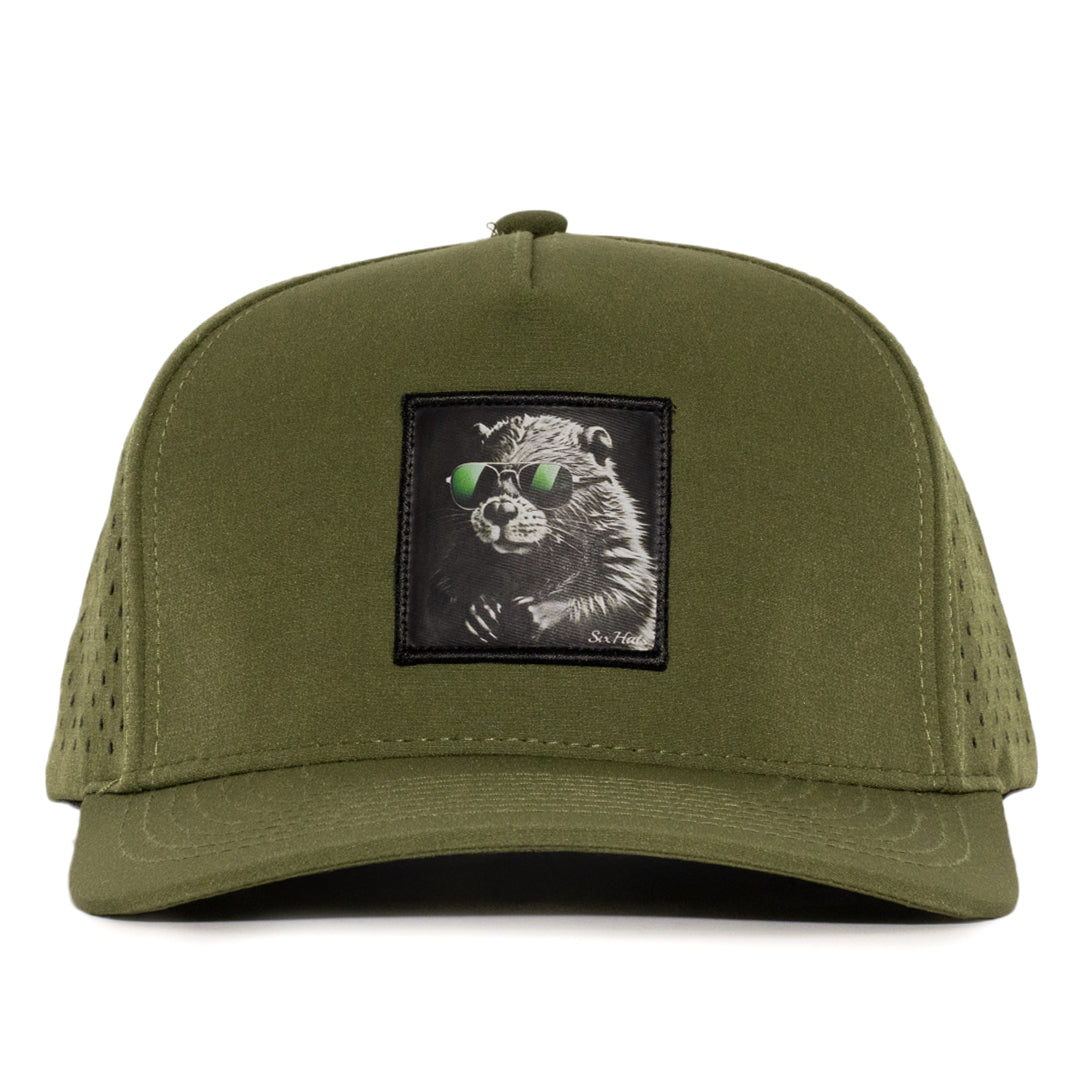 Forest Green waterproof baseball cap with a black fabric patch featuring a beaver design Six hats Supply 